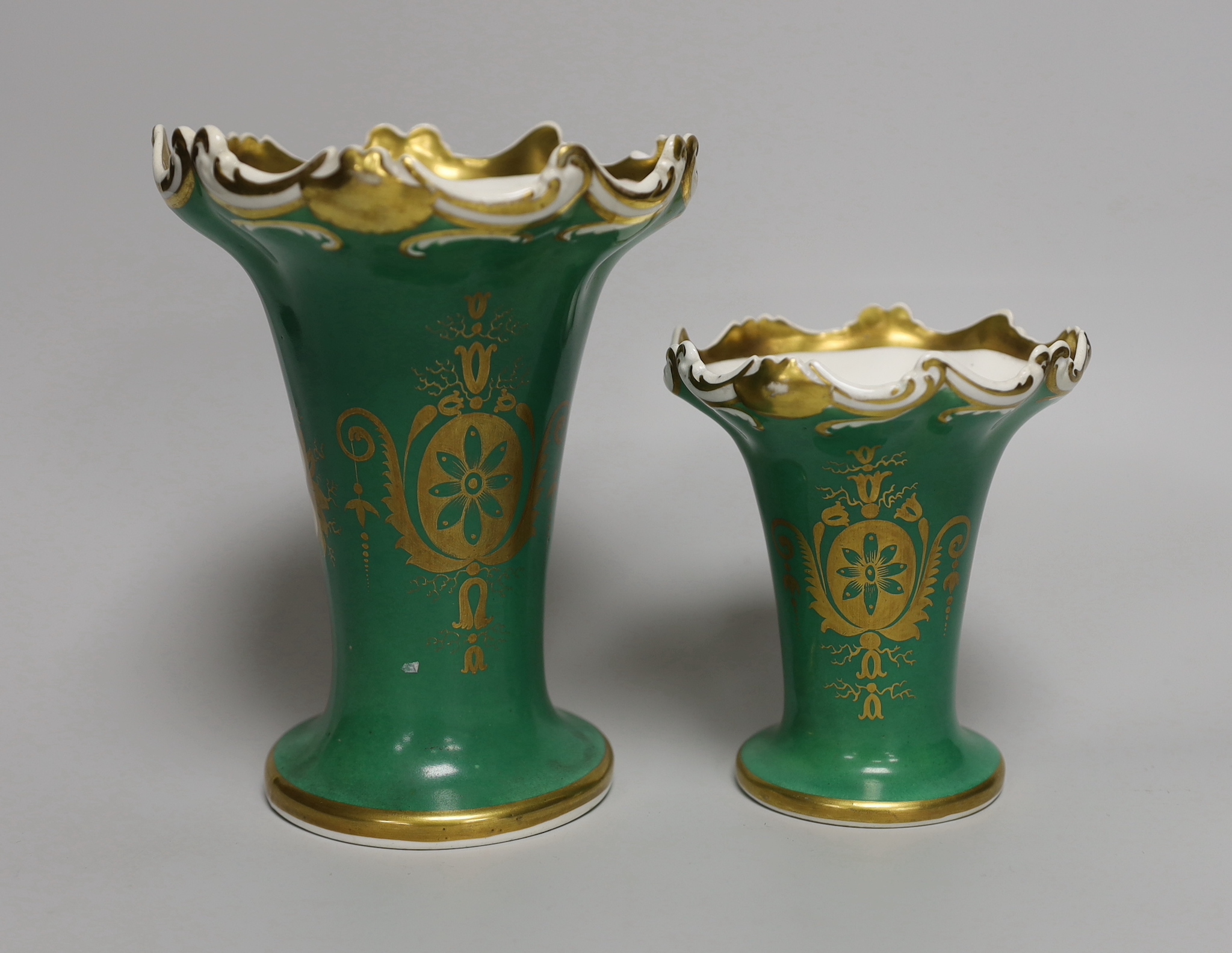 A pair of Rockingham type graduated vases with landscapes, tallest 17cm high